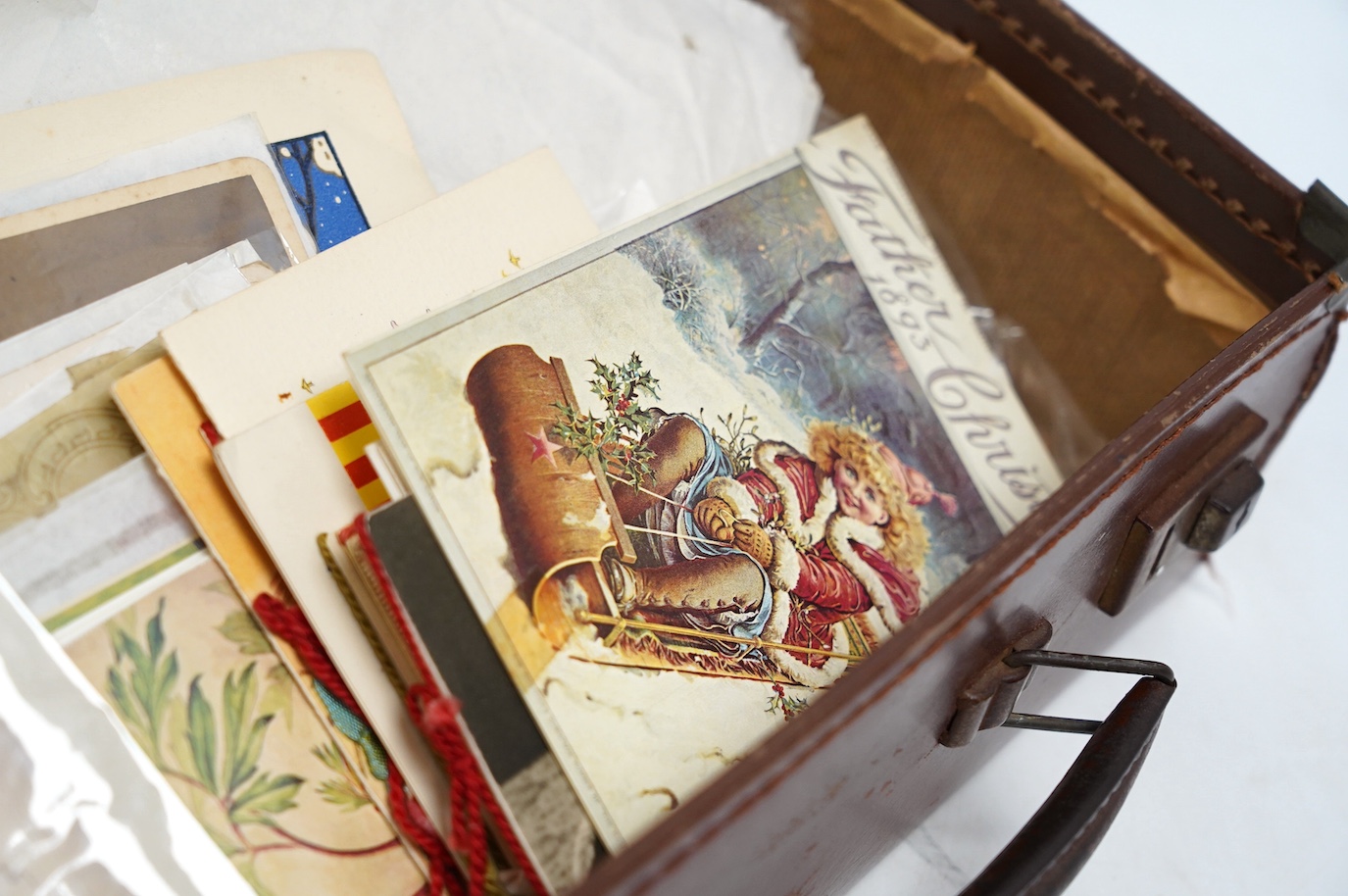 A small quantity of assorted Victorian and later greetings cards, photographs etc., including some embroidered examples. Condition - fair